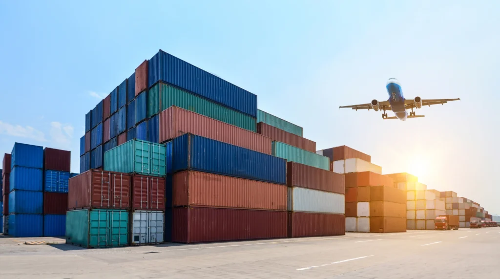 Air freight cargo plane loading goods at airport with containers and logistics staff handling shipments securely